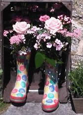 Lymington Florist - flowers in wellington boots for a country church wedding